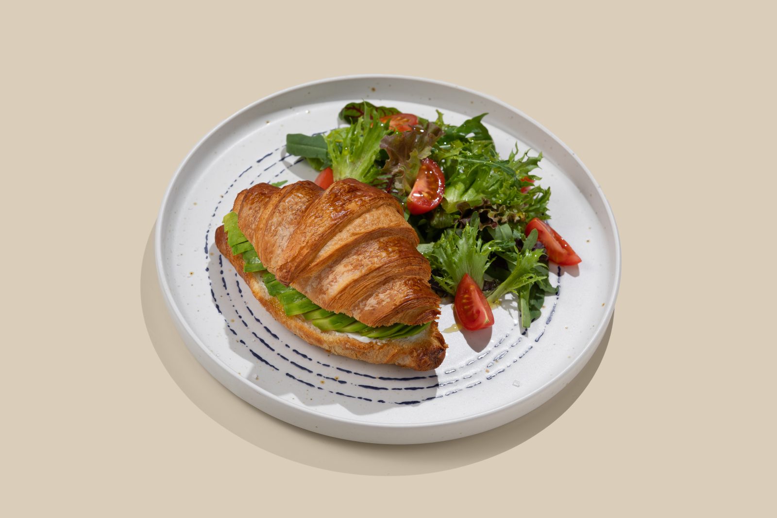 Croissant with cream cheese and avocdo